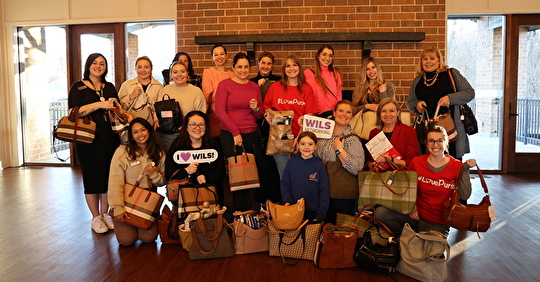 WILS-Chi Members Pack Purses to Support Women